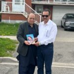 Shoaib Nasir Presenting His Novel "Zartaj Gull" to Nasir Ali Syed.